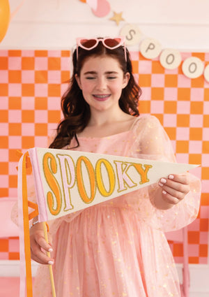 Girl holding Spooky Era Felt Pennant Flag | The Party Darling