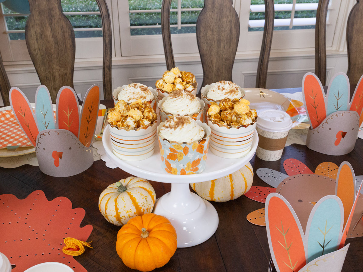 https://thepartydarling.com/cdn/shop/files/thanksgiving-cupcakes_1200x.jpg?v=1696612569