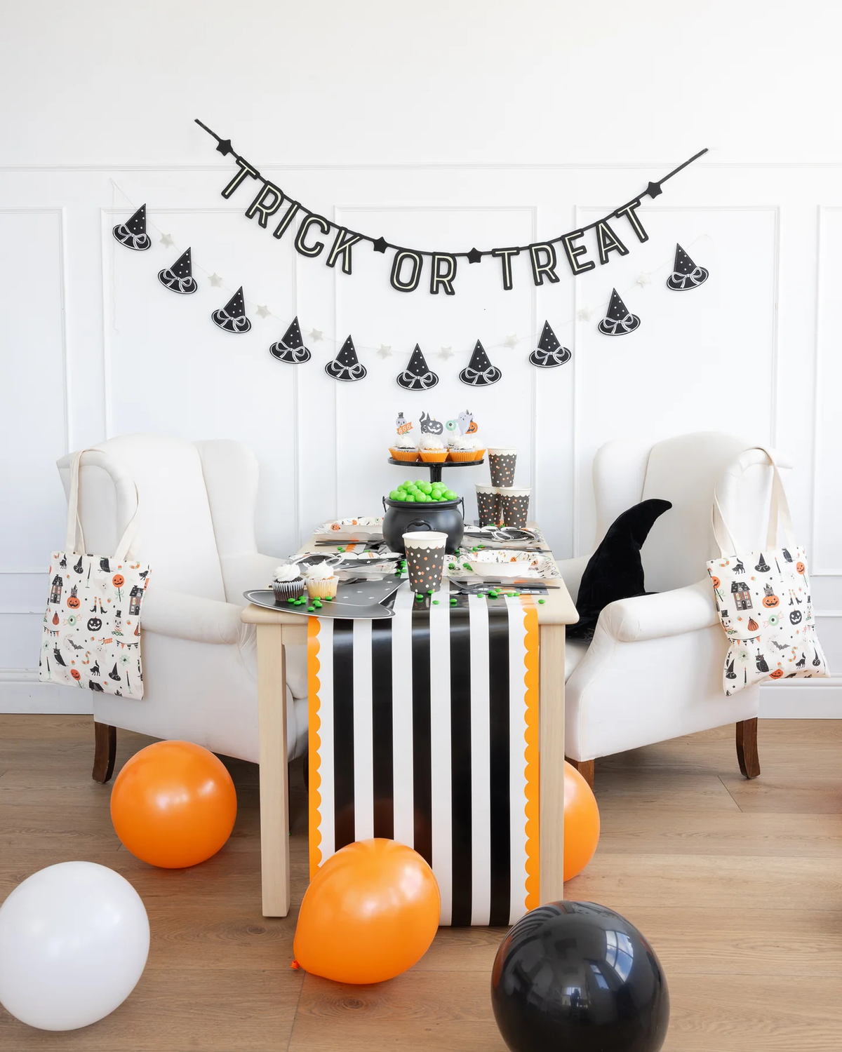 Halloween-themed decor with &#39;Trick or Treat&#39; banner.
