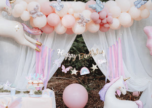 Magical Unicorn Birthday Banner with unicorns, butterflies, and a rainbow | The Party Darling