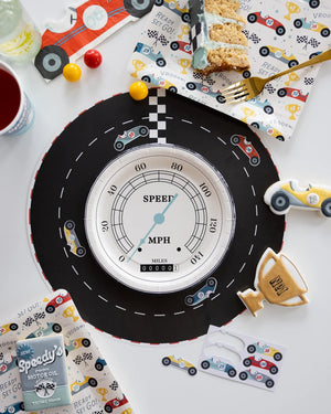 Speedometer paper plate sitting on a round race track placemat