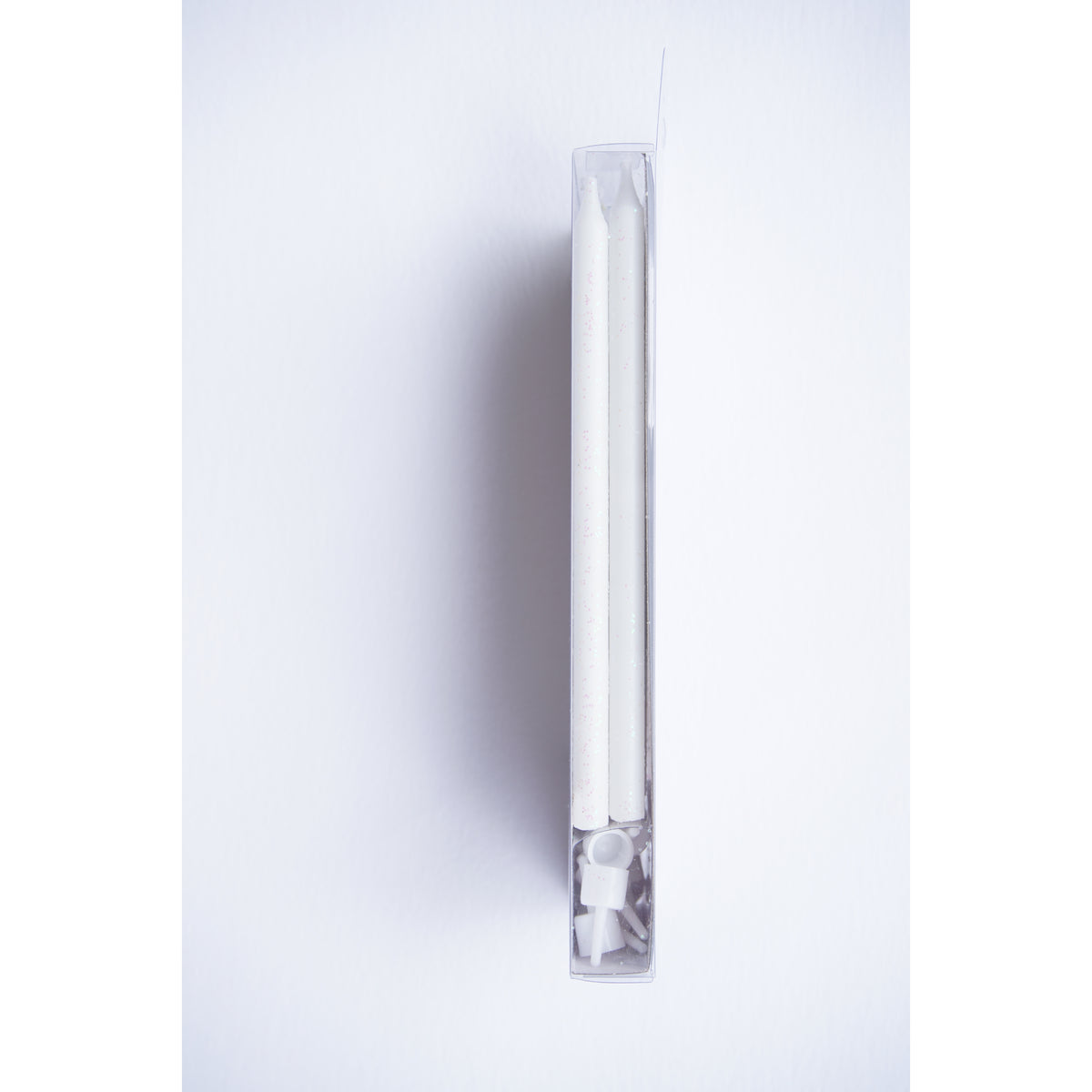 side view of Tall White Glitter Candle Set 16ct.