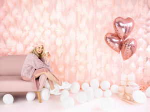 girl sitting with Rose Gold Heart Foil Balloon 18"