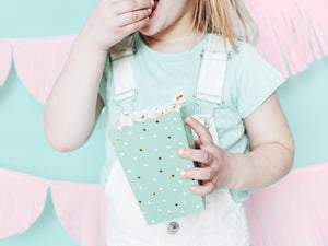 child eating popcorn from box