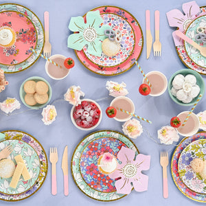 floral party table with pink wooden cutlery