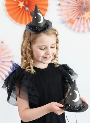 Girl Wearing a Mini Halloween Witch Hats