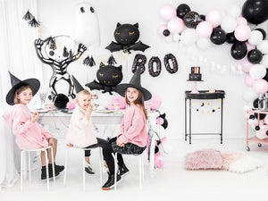 pink and black halloween party setup
